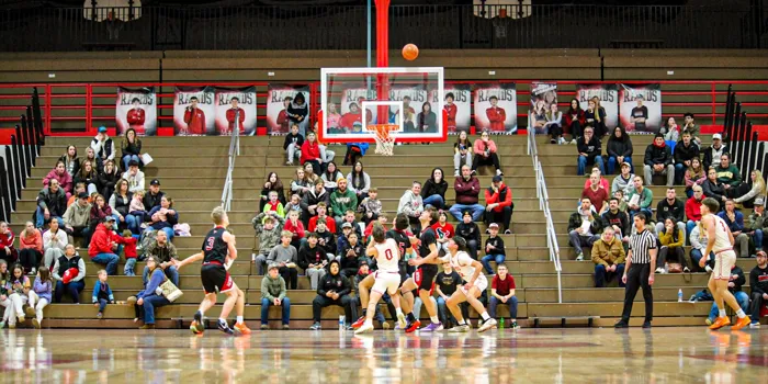 Wide view of a basketball game and the crowd