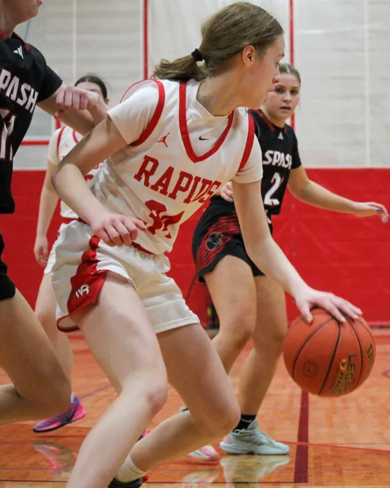 Rapids basketball player driving toward the basket