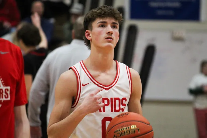Rapids basketball player holding a basketball