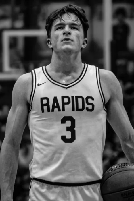 Black and white portrait of a Rapids basketball player